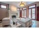 Bright living room with fireplace, double doors and white sofas at 1751 Clermont St, Denver, CO 80220