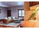Open living room with hardwood floors and seamless flow to the kitchen at 1751 Clermont St, Denver, CO 80220