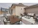 Charming back deck with dining and lounge areas, perfect for outdoor entertaining at 4055 S Niagara Way, Denver, CO 80237