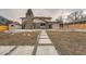 Backyard featuring concrete pavers with decorative gravel, grass, and direct access to a charming backyard deck at 4055 S Niagara Way, Denver, CO 80237