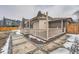 Charming backyard deck with a light-colored fence, offering a cozy outdoor space for relaxation and entertainment at 4055 S Niagara Way, Denver, CO 80237