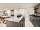This finished basement has a modern bar with seating and lots of countertop space at 4055 S Niagara Way, Denver, CO 80237