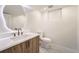 Modern bathroom with a unique mirror, sleek vanity, and contemporary fixtures for a stylish design at 4055 S Niagara Way, Denver, CO 80237