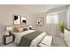 Comfortable bedroom with large windows, stylish decor, and a soothing color palette at 4055 S Niagara Way, Denver, CO 80237