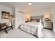 Cozy bedroom features neutral tones, an area rug, and a large closet at 4055 S Niagara Way, Denver, CO 80237