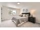 Bright bedroom featuring plush carpeting, contemporary decor and accents, and a large picture window at 4055 S Niagara Way, Denver, CO 80237