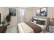 Comfortable bedroom with soft neutral tones, stylish decor, and a serene atmosphere for relaxation at 4055 S Niagara Way, Denver, CO 80237