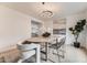 Elegant dining room with stylish decor and large windows offering natural lighting at 4055 S Niagara Way, Denver, CO 80237