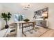 Bright dining room featuring contemporary decor and a view of the outdoor scenery at 4055 S Niagara Way, Denver, CO 80237