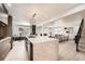Open-concept kitchen featuring a marble island and seamless connection to the living area at 4055 S Niagara Way, Denver, CO 80237