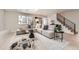 Bright living room features a skylight, contemporary decor, modern stairs and light-colored wood floors at 4055 S Niagara Way, Denver, CO 80237