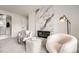 Sitting area features modern decor, a fireplace with marble surround, and neutral paint at 4055 S Niagara Way, Denver, CO 80237