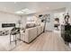 Bright, airy living room with a sleek fireplace, skylight, and stylish, comfortable seating at 4055 S Niagara Way, Denver, CO 80237