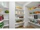 Well-organized pantry showcasing shelving and a variety of food items at 4055 S Niagara Way, Denver, CO 80237