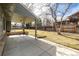 Concrete patio and backyard with grass and a wooden fence at 8025 S Cody St, Littleton, CO 80128