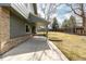 Covered patio area extends to the grassy yard with wood fence and mature trees at 8025 S Cody St, Littleton, CO 80128