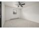 Bright bedroom with neutral carpet, ceiling fan, and a window with blinds at 8025 S Cody St, Littleton, CO 80128
