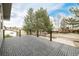 Spacious deck with interlocking tiles and black metal railing, offering a great outdoor living space at 8025 S Cody St, Littleton, CO 80128