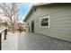 Spacious deck with interlocking tiles and black metal railing, offering a great outdoor living space at 8025 S Cody St, Littleton, CO 80128