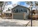 Charming two-story home with a two car garage, brick accents, neutral paint, and upper deck at 8025 S Cody St, Littleton, CO 80128