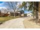 Charming two-story home with a two car garage, brick accents, neutral paint, and upper deck at 8025 S Cody St, Littleton, CO 80128