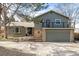 Charming two-story home with a two car garage, brick accents, neutral paint, and upper deck at 8025 S Cody St, Littleton, CO 80128