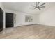 Bright living room featuring a bay window and modern ceiling fan, offering a comfortable and inviting space at 8025 S Cody St, Littleton, CO 80128
