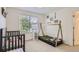 Charming bedroom with teepee bed and crib at 10218 Cavaletti Dr, Littleton, CO 80125