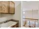 Convenient laundry room with upper cabinets and a utility sink at 10218 Cavaletti Dr, Littleton, CO 80125