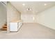 Finished basement with a bar, open layout, modern lighting, and painted block wall at 1452 S Washington St, Denver, CO 80210