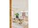 Bright dining room featuring a large wooden table, modern lighting, and a stylish sideboard at 1452 S Washington St, Denver, CO 80210