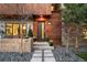 Contemporary entrance with wood siding, modern design, landscaping and stone paver walkway at 1452 S Washington St, Denver, CO 80210