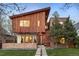 Contemporary exterior featuring wood siding, modern design, and professionally landscaped front yard at 1452 S Washington St, Denver, CO 80210