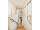 Bright hallway with hardwood floors and large windows offering plenty of natural light at 1452 S Washington St, Denver, CO 80210