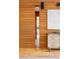 Elegant hallway with warm wood accents, stylish artwork, and a peek into the next room at 1452 S Washington St, Denver, CO 80210