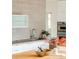 Modern kitchen area featuring concrete countertops, sleek appliances, and stylish backsplash at 1452 S Washington St, Denver, CO 80210