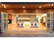 A modern kitchen with high-end appliances and an island with bar seating, open to an outdoor living area at 1452 S Washington St, Denver, CO 80210
