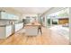 Bright kitchen featuring light wood floors, butcher block islands and direct access to the backyard at 1452 S Washington St, Denver, CO 80210