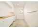 Minimalist laundry room with plenty of counter space and storage at 1452 S Washington St, Denver, CO 80210