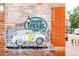 South Pearl Street mural with a vintage car in front of a brick wall at 1452 S Washington St, Denver, CO 80210