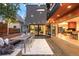 Inviting backyard patio area with a long dining table and seamless indoor-outdoor flow to the interior at 1452 S Washington St, Denver, CO 80210