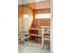 Inviting sauna with wooden benches, wood paneling and a glass door and window at 1452 S Washington St, Denver, CO 80210