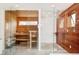 Well-lit sauna and shower featuring modern fixtures, wooden accents and glass enclosures at 1452 S Washington St, Denver, CO 80210
