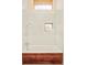 Shower area with white tiling, a rainfall shower head, and a wood-covered base in the tub at 1452 S Washington St, Denver, CO 80210