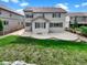 Expansive backyard with large patio area and mature landscaping at 2180 Trailblazer Way, Castle Rock, CO 80109