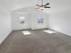 A bedroom is illuminated with natural light and features a ceiling fan and neutral carpeting at 2180 Trailblazer Way, Castle Rock, CO 80109