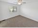 Bedroom with a carpeted floor, window and view of trees outside at 2180 Trailblazer Way, Castle Rock, CO 80109