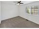 Bright bedroom featuring neutral carpet, natural light, and a ceiling fan at 2180 Trailblazer Way, Castle Rock, CO 80109