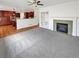 Inviting living room boasts gas fireplace, custom built-ins, and open access to a modern kitchen at 2180 Trailblazer Way, Castle Rock, CO 80109