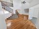 Bright living room features high ceilings, hardwood floors, and staircase at 2180 Trailblazer Way, Castle Rock, CO 80109